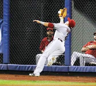 Parra hit the ground on his shoulder and arm, rolled into the fence in front of the bullpen