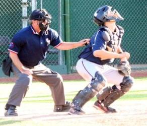 ready to provide the catcher with room to field the pop up