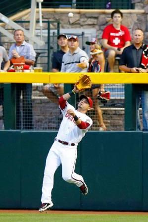 setting up to catch the ball on his throwing side