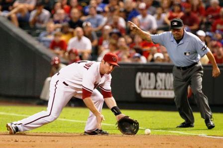 Feet a little wider than shoulders,knees bent, your knees take your glove to the ground.  Field ball out in front.