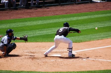 sacrifice bunt,  note the player is bunting first, running second. Very Important!