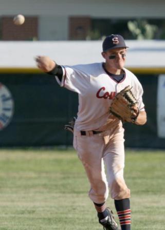 shortstop making throw to plate