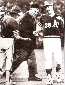 ump casually checking touch of home plate