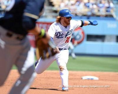 Runner from second fails to tag, makes third out at second.