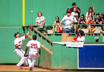 Home run or out, if the player catches the ball and falls into the stands?