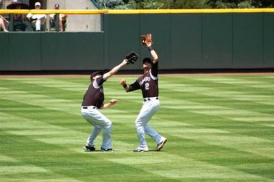 Left fielder, shortstop converging on pop fly